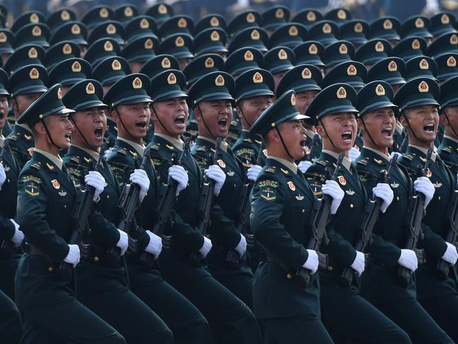 (FILES) This file photo taken on October 1, 2019 shows Chinese troops marching during a military parade in Tiananmen Square in Beijing to mark the 70th anniversary of the founding of the People's Republic of China. - China will increase its military budget by 6.6 percent in 2020, the government announced on May 22, 2020 at the opening session of its annual National People's Congress in Beijing. (Photo by Greg BAKER / AFP)