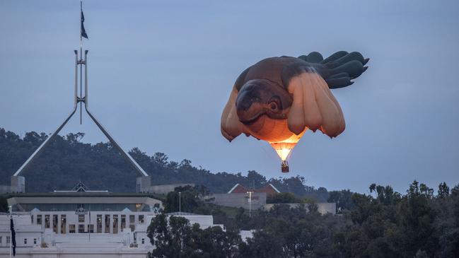 Patricia Piccinini’s iconic Skywhale air balloon artwork flies against the backdrop of Parliament House. Picture: NCA NewsWire/Gary Ramage