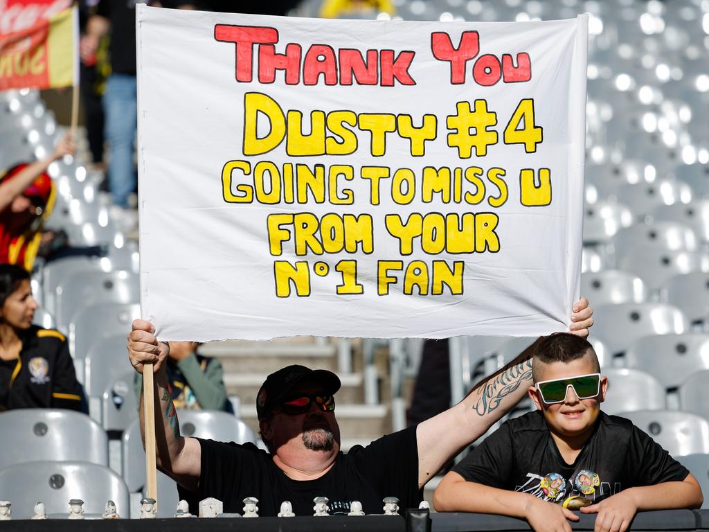 Two Tigers fans show their appreciation for the retiring champion. Picture: Dylan Burns/AFL Photos via Getty Images