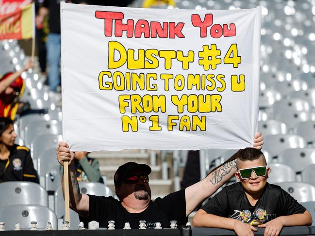 Two Tigers fans show their appreciation for the retiring champion. Picture: Dylan Burns/AFL Photos via Getty Images