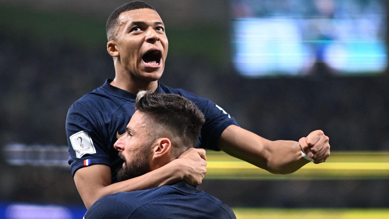 Mbappe celebrates with Olivier Giroud after setting up the opener. (Photo by Kirill KUDRYAVTSEV / AFP)