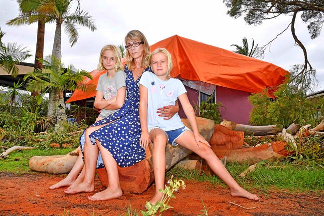 Marvelled Lockett with her two girls Sofia and Grace, both aged 9, at their home in Little Mountain, which was damaged in storms. Picture: John Gass