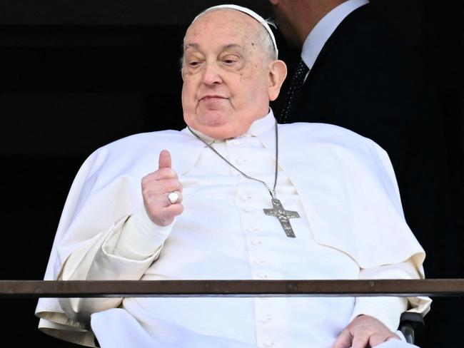 Pope Francis appears at a window of the Gemelli hospital before being discharged following a five weeks hospitalisation for pneumonia, in Rome on March 23, 2025. Picture: AFP