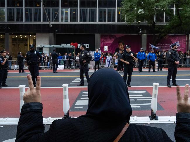 A person gestures as opposing pro-Israel and pro-Palestine groups protest near the Israeli consulate in New York City. Picture: Getty Images via AFP