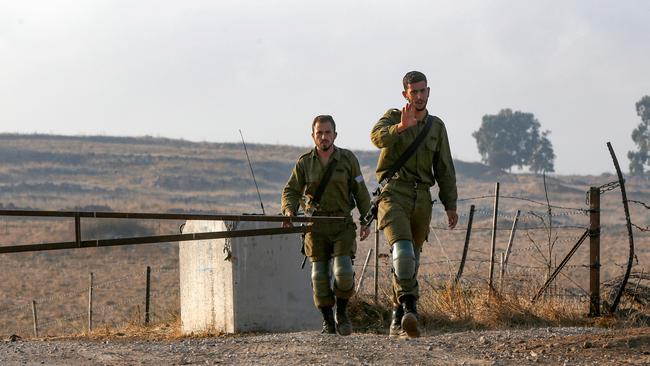 Israeli troops near the site of the Hezbollah raid. Picture: AFP