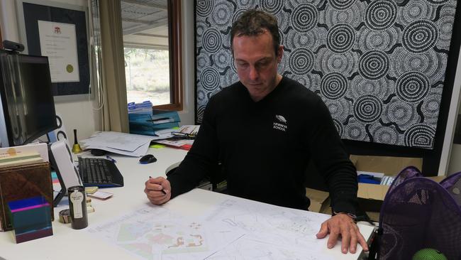 Yipirinya School Principal Gavin Morris with plans for the 80-bed boarding house. Picture: Gera Kazakov