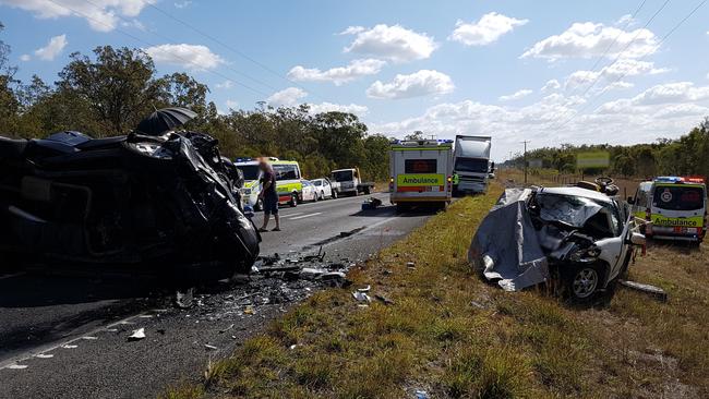 Emergency services at the scene of a double fatality at Childers yesterday.