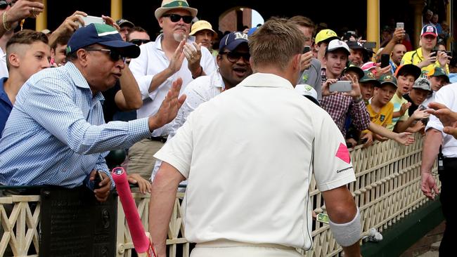 Warner is applauded by the SCG crowd as he walks off for lunch. Picture: Gregg Porteous