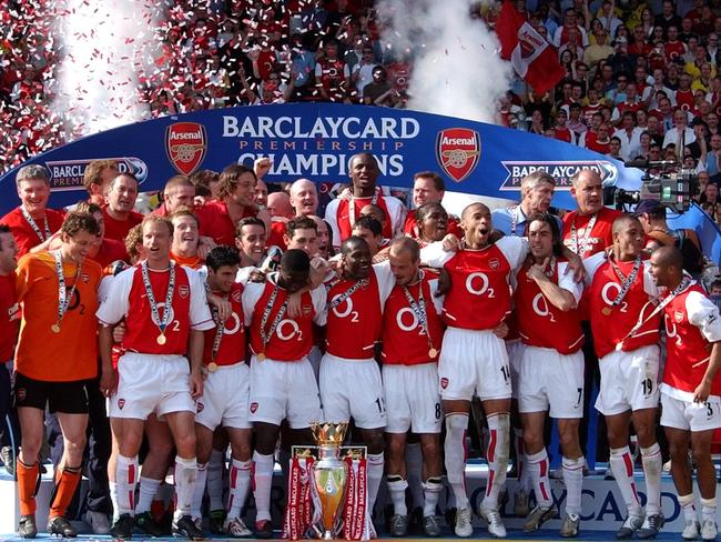 Arsenal’s “Invincibles” pose with English Premier League trophy at Highbury in 2004 after becoming the first team in 115 years to go through the season undefeated. Picture: AP