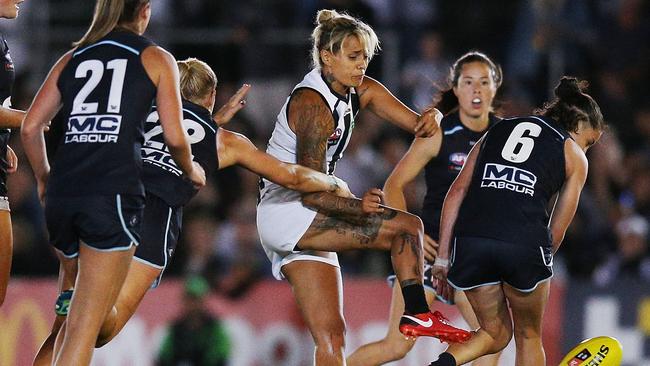 Moana Hope surrounded by Carlton players.