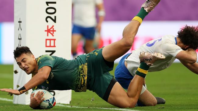 Jordan Petaia of Australia dives to score his side's second try during the Rugby World Cup in Oita, Japan. (Photo by Dan Mullan/Getty Images)