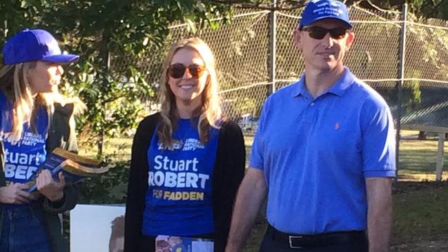 Fadden MP Stuart Robert outside a Labrador booth with supporters.