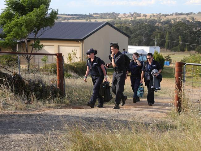 Police leave after spending the day collecting evidence. Picture: Brad Newman