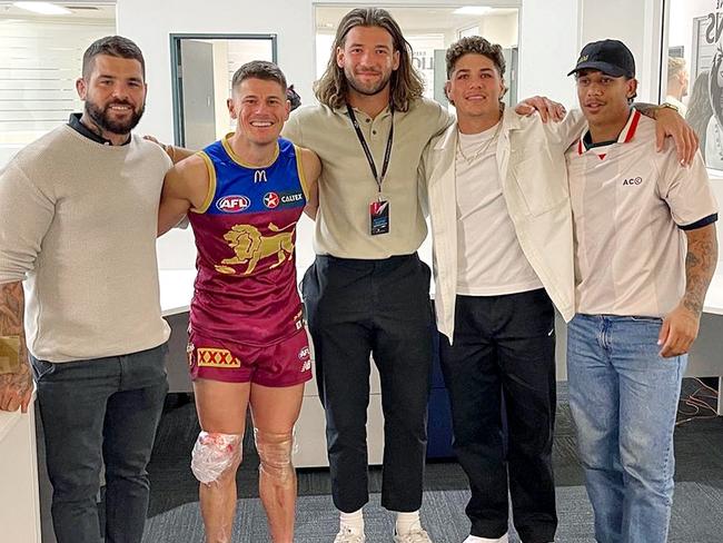 The Lions’ Dayne Zorko (second from left) with Broncos players (from left) Adam Reynolds, Pat Carrigan, Reece Walsh and Tristan Sailor after the Lions defeated Port Adelaide at the Gabba