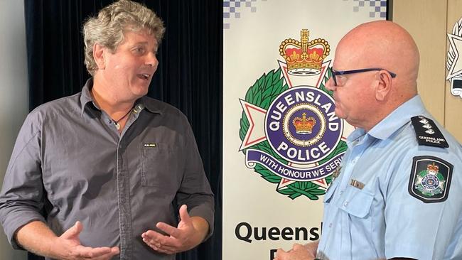 Mike Joyce, DES manager of wildlife operations, speaks with Inspector Mark Henderson of Cairns Police about the circumstances surrounding the disappearance of Kevin Darmody. Picture: Isaac McCarthy