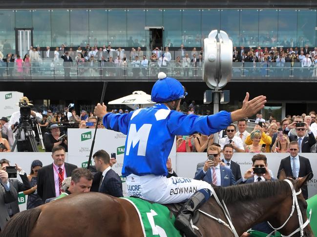 Hugh Bowman returns to scale after riding Winx to another victory.