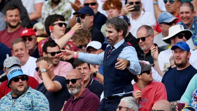 A lookalike for England manager Gareth Southgate tries to rev up the crowd. Picture: Getty