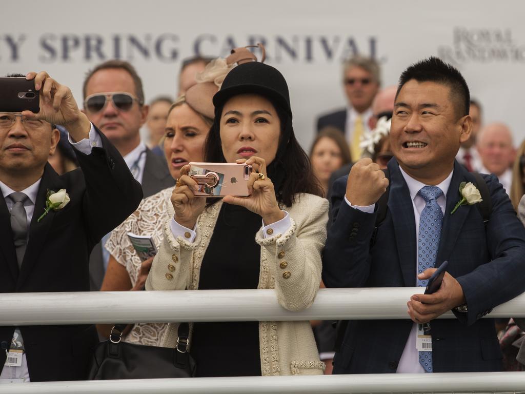 Members of the Chinese Race Club watch the running of race 2 Pic Jenny Evans