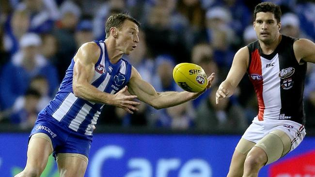 Brent Harvey gathers in front of Leigh Montagna in his 427th game. Picture: Mark Stewart