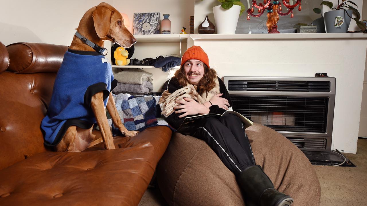 Matt Casalis, 27, said he is using blankets, scarfs and an Oodie to keep warm as heating is too expensive. Picture: NCA NewsWire / Nicki Connolly