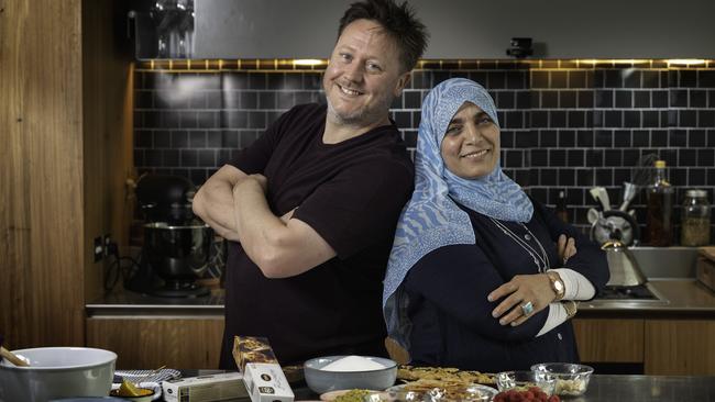 Dessert whiz Darren Purchese with asylum seeker Aheda in the kitchen. Picture: Tony Gough