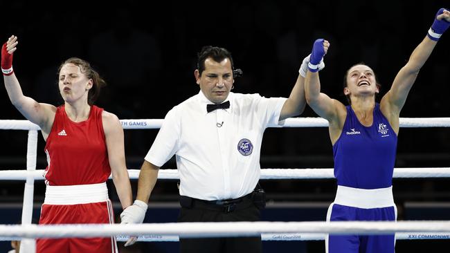 Northern Ireland's Michaela Walsh (red) reacts to Australia's Skye Nicolson winning gold in the women's 57kg boxing final. Picture: Adrian Dennis