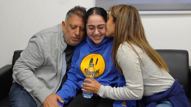 Former Israeli hostage Liri Albag is reunited with family members at an army screening point in Reim in southern Israel on Saturday. Picture: Israeli army via AFP