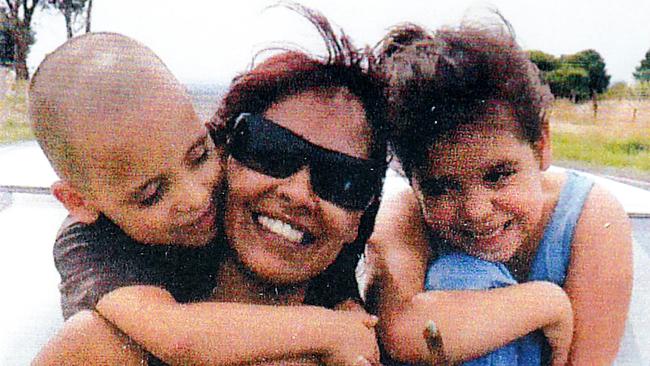 Korey Mitchell, left, his mother Adeline Yvette Wilson-Rigney, centre, and sister Amber Rose Rigney, right.