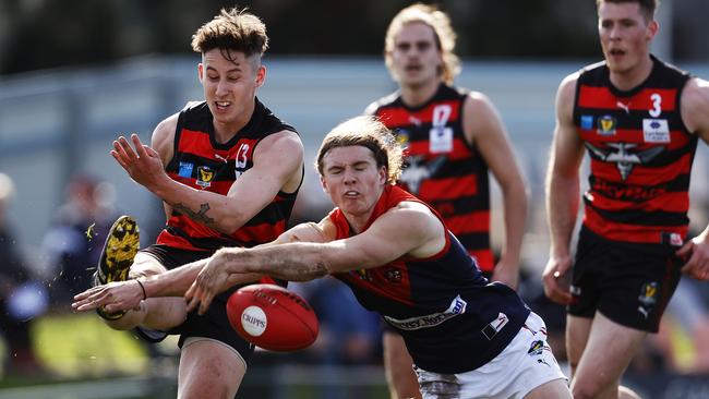 Round 8 TSL game between Lauderdale v North Hobart from Lauderdale Oval. North Hobart's Jye Menzie smothers the kick of Lauderdale's Jeremiah Perkins. Picture: ZAK SIMMONDS