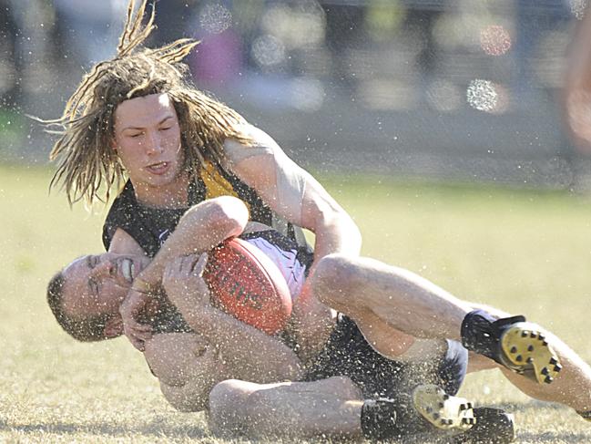 s13fs854 - Peninsula League Grand Final at Frankston football oval. EdiAsp vs. Seaford. Chris Irving tackles EdiAsp's Mark Fitcher.