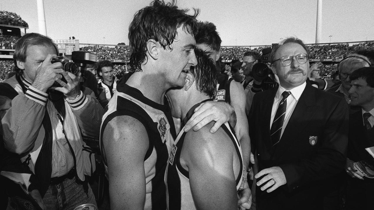 Mick McGuane and Tony Shaw embrace after victory in the 1990 Grand Final.