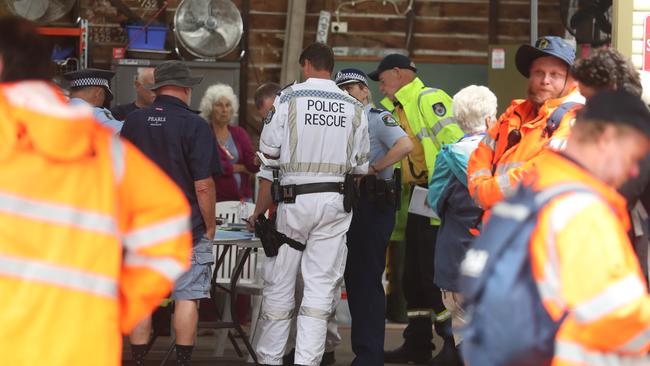 Police, SES and RFS crews ahead of a land search in bushland this morning near Mooney Mooney. Picture: John Grainger
