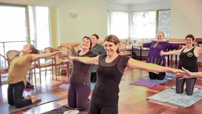 FIT TOGETHER: Staff at Dougherty Villa enjoy an afternoon of Pilates as part of their 'Biggest Loser' initiative. Picture: Tim Jarrett