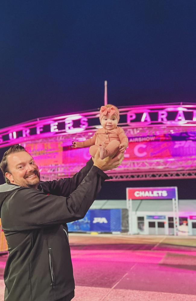 Pacific Airshow director Kevin Elliott with his three-month-old daughter Goldie in central Surfers Paradise. Goldie was conceived during the inaugural airshow in 2023 and is named for the Gold Coast. Picture: Supplied