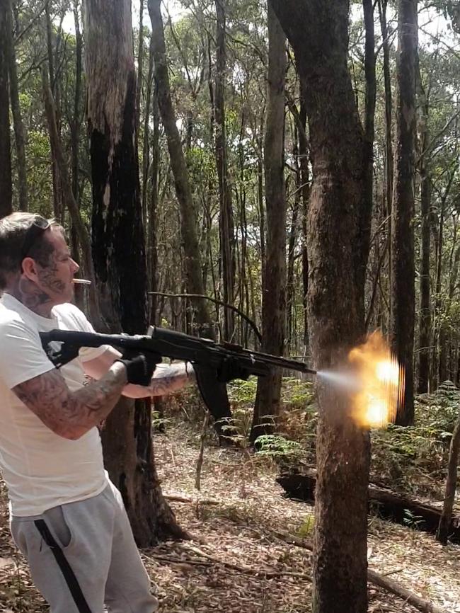 Image of Matthew Bruce testing out his machine gun.