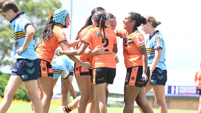 Harvey Norman U17 Tigers Charlotte Keki, Charlize Duncan (No.2) and Tiahna Kanawi, far right, congratulate Leilani Taofinuu. Picture, John Gass