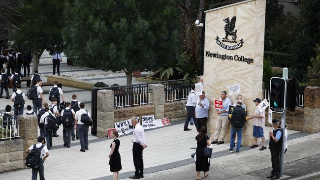 Parents protest the co-ed decision on the first day of Newington College’s school year on Wednesday.