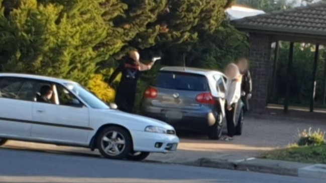 A still image of footage of the Matthew Kokotis and Steve Orfanidis threatening a couple outside their home. A judge has said he will be unable to conclude whether it was a real or imitation firearm.