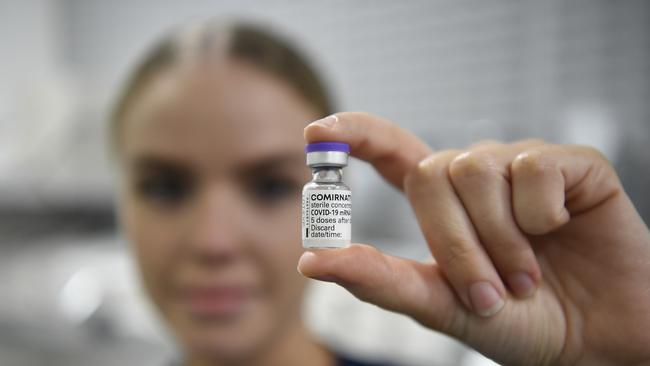 Registered Nurse Christina O'Donnell holds a vial of the Pfizer Covid-19 vaccine. Picture: Ian Hitchcock