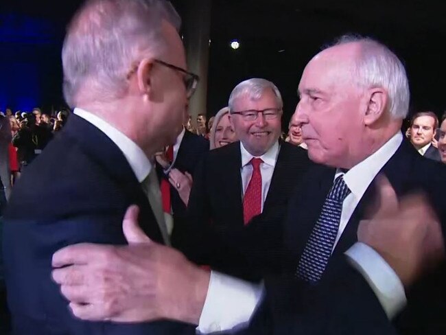 Mr Albanese is greeted by Paul Keating and Kevin Rudd.