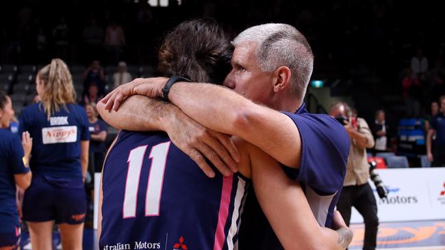 Lightning coach Chris Lucas hugs Penina Davidson after the win during game two of the WNBL grand final series between the Adelaide Lightning and the UC Capitals at Titanium Security Arena. Picture: AAP Image/Kelly Barnes