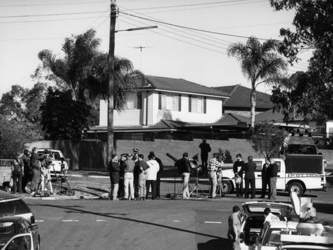 Media and police outside Newman’s house following his murder on September 5, 1994.