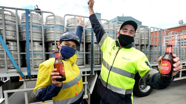 Laly Navarro and Ahmet Kurtdereli from Carlton United Brewery prepare for pubs to reopen. Picture: Andrew Henshaw