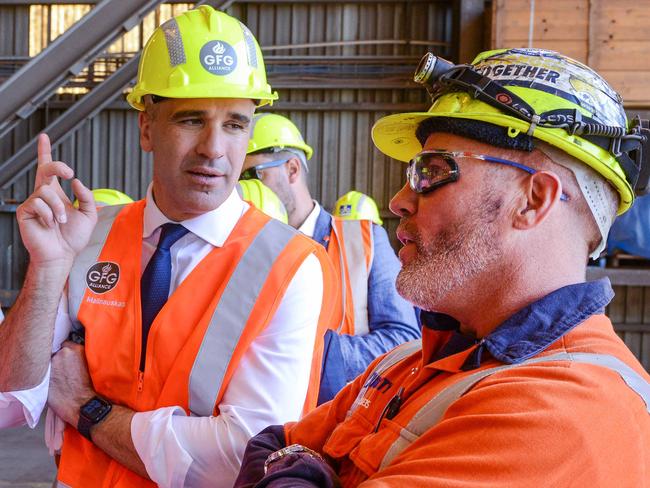 Premier Peter Malinauskas and Federal Minister Ed Husic talk to steel worker Matt Rogers after announcing the Whyalla steel plant will be run on hydrogen fuel, making it the first green steel plant in the world. April 4, 2023. Picture: GFG ALLIANCE/Brenton Edwards