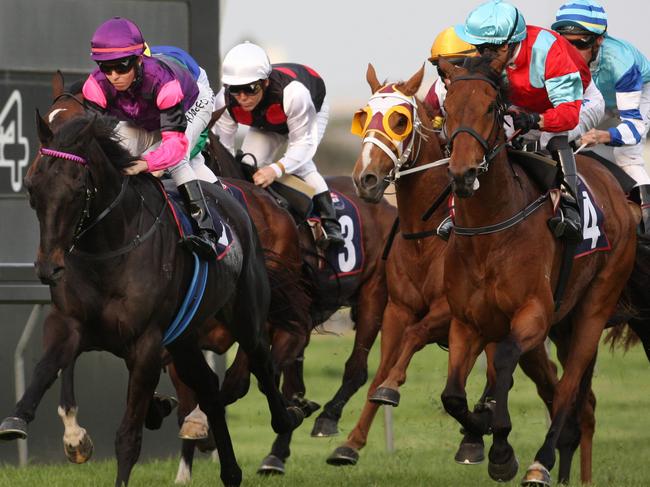 Broadmeadow Racecourse. Race 8. Newcastle Gold Cup (left) Taking the lead on the first lap round Jockey Kerrin McEvoy onboard Street Fighter in the lead on the first lap round.