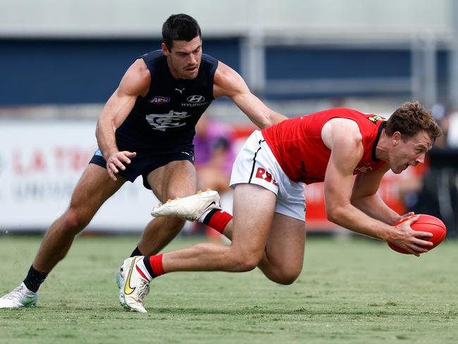 Jack Macrae leads George Hewett to the ball.