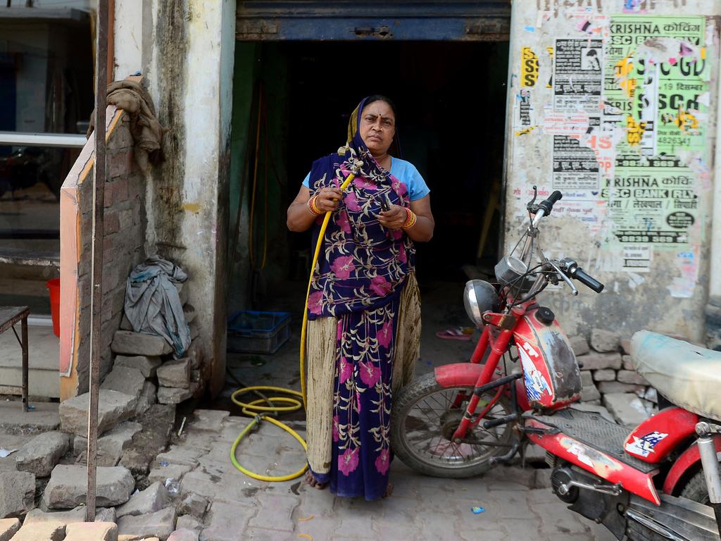 Rajpati Devi, 45, a bike mechanic and puncture repairer, at her roadside workshop in Allahabad, India on February 24, 2018. Picture: AFP