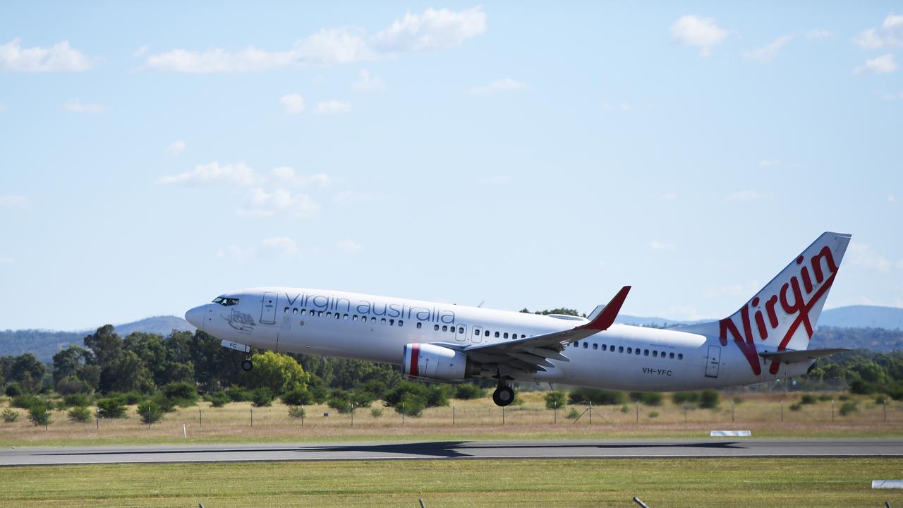 An almost empty Virgin flight departs Rockhampton for Brisbane.