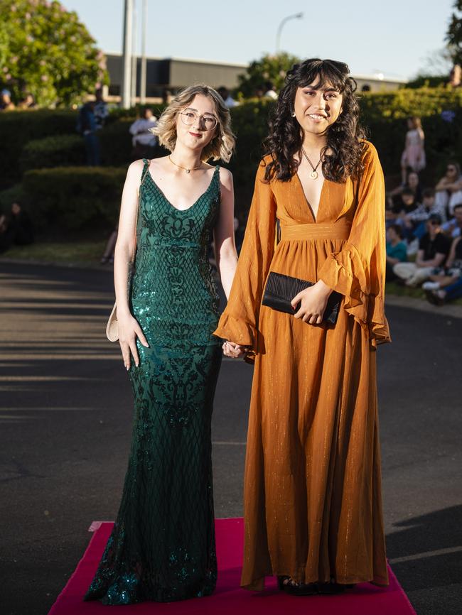 Tylah Bill (left) and Buffy Kino arrive at Harristown State High School formal at Highfields Cultural Centre, Friday, November 18, 2022. Picture: Kevin Farmer