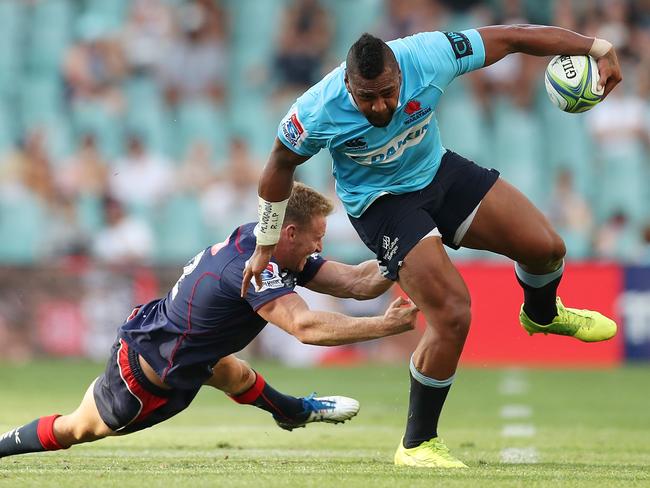 Taqele Naiyaravoro beats Reece Hodge.